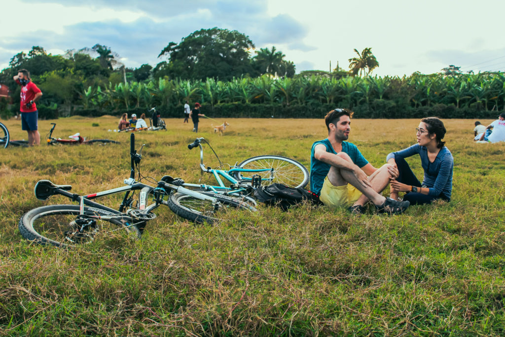 Cyclists enjoying a picnic with bicycles in Havana's green spaces