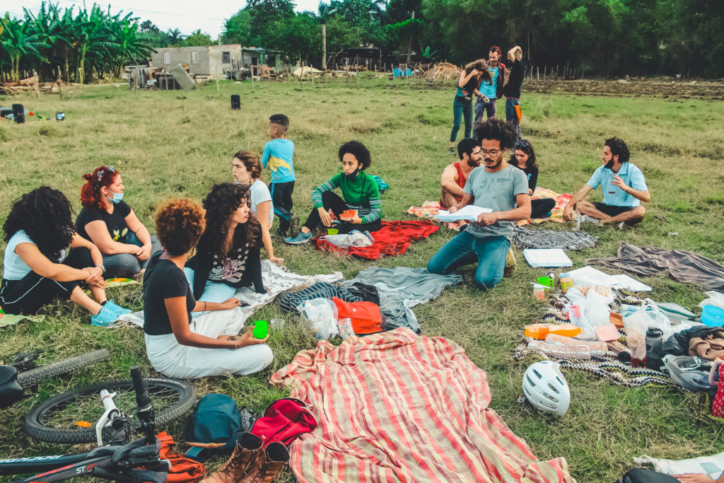 Young Cubans enjoy a picnic in Havana's green spaces with music, food and bicycles